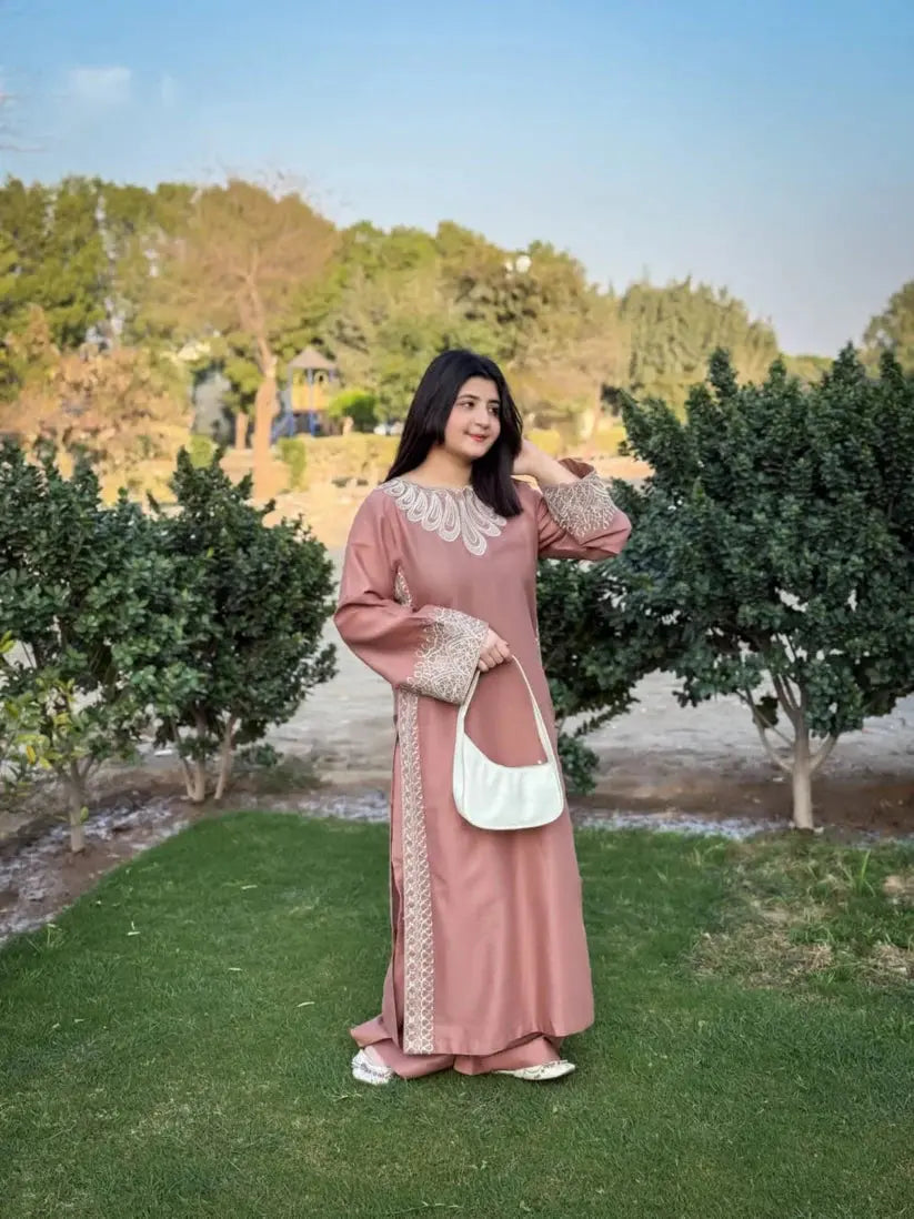 Detailed embroidery on sleeves and premium fabric of Maria 2 piece embroidered palazzo suit by Shai Noor.