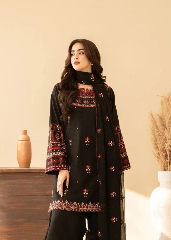 Shai Noor 3-piece embroidered lawn suit for women, featuring intricate embroidery on fabric, made in Pakistan.