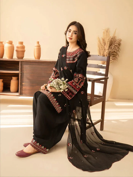 Shai Noor 3-piece embroidered lawn suit for women featuring intricate designs, made in Pakistan, displayed in the image.