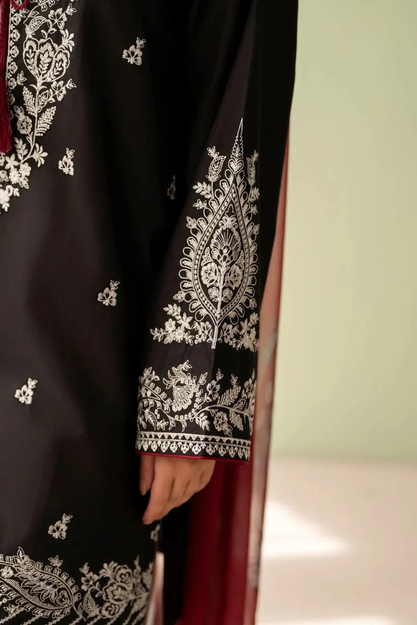 Shai Noor Gul e Siyah 3-piece embroidered lawn suit for women, featuring intricate embroidery on black fabric with matching dupatta and trousers.