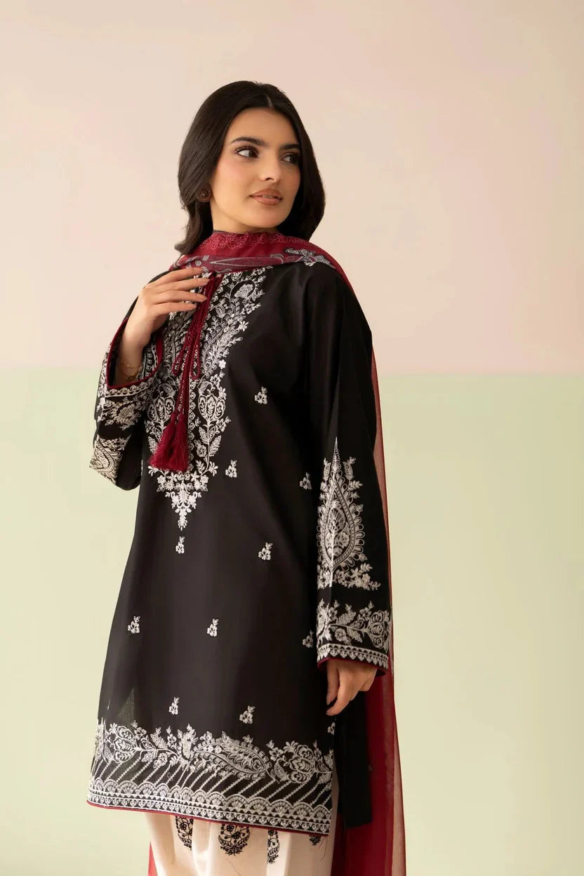 Shai Noor Gul e Siyah 3-piece embroidered lawn suit for women with intricate embroidery on black fabric, includes dupatta, shirt, and trousers.