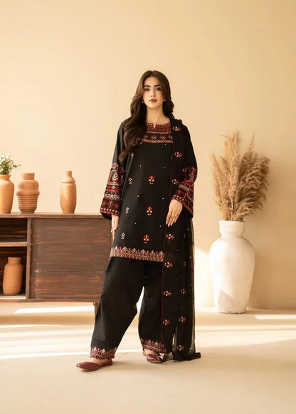 Shai Noor 3-piece embroidered lawn suit for women featuring intricate embroidery in vibrant colors, made in Pakistan.