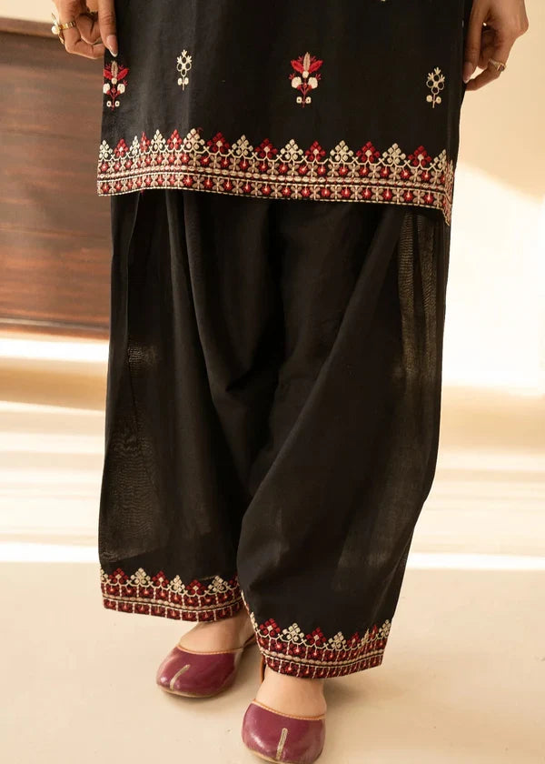 Shai Noor 3-piece embroidered lawn suit for women featuring intricate embroidery on the shirt, dupatta, and trousers, made in Pakistan.
